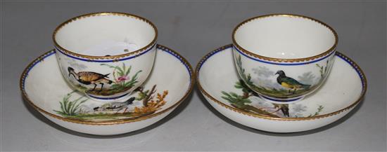 A pair of Sevres tea bowls and saucers